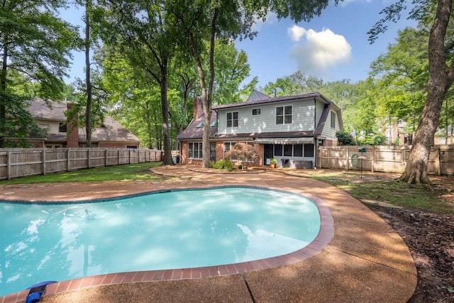 1625 Autumn Tree Cv, Memphis, TN 38016 - view of swimming pool with a fenced backyard, a patio area, and a sunroom
