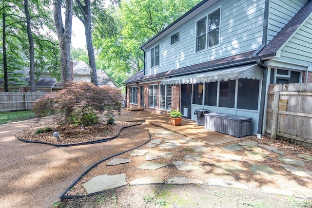 1625 Autumn Tree Cv, Memphis, TN 38016 - back of house featuring a patio, a shingled roof, and brick siding