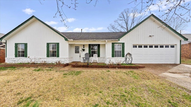 6861 Sauterne Cv, Memphis, TN 38115 - view of front of home featuring driveway, a garage, a porch, and a front yard