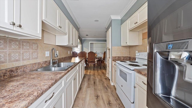 6861 Sauterne Cv, Memphis, TN 38115 - kitchen with white electric stove, a sink, crown molding, decorative backsplash, and white cabinetry