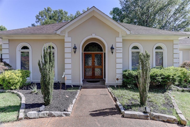 6703 N Kirby Oaks Cv, Memphis, TN 38119 - entrance to property with roof with shingles, stucco siding, and french doors