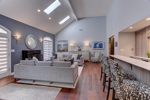 6703 N Kirby Oaks Cv, Memphis, TN 38119 - living area with beamed ceiling, high vaulted ceiling, a skylight, dark wood finished floors, and recessed lighting