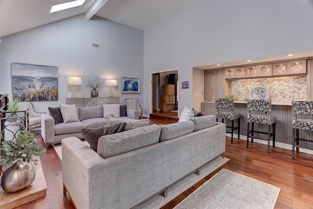 6703 N Kirby Oaks Cv, Memphis, TN 38119 - living area with high vaulted ceiling, beam ceiling, wood finished floors, and a skylight