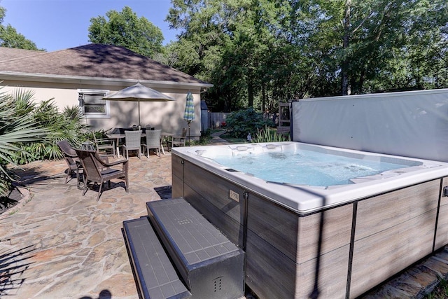 6703 N Kirby Oaks Cv, Memphis, TN 38119 - view of patio / terrace featuring a hot tub and outdoor dining space
