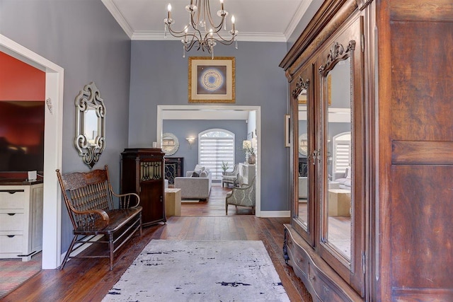 6703 N Kirby Oaks Cv, Memphis, TN 38119 - entryway with dark wood finished floors, a chandelier, crown molding, and baseboards