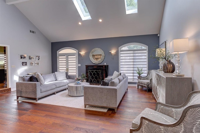 6703 N Kirby Oaks Cv, Memphis, TN 38119 - living room featuring high vaulted ceiling, a skylight, wood finished floors, and recessed lighting