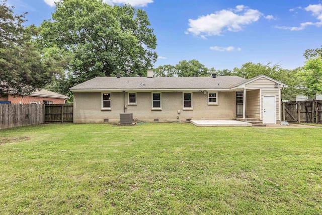 5251 Sequoia Ave, Memphis, TN 38120 - rear view of house featuring crawl space, a chimney, central AC, brick siding, and an attached garage