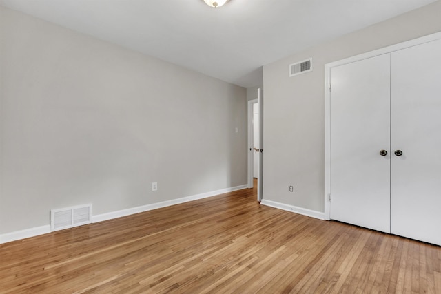 5251 Sequoia Ave, Memphis, TN 38120 - unfurnished bedroom featuring light wood-style floors, baseboards, and a closet