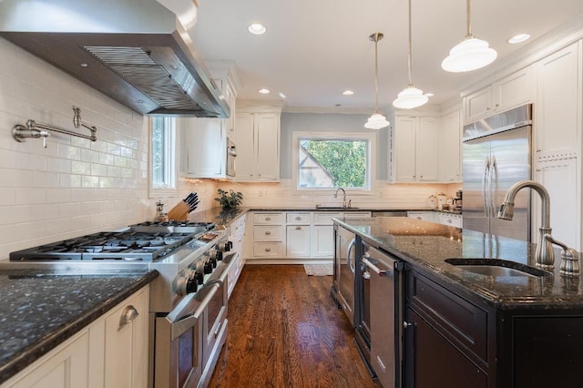 1514 Vance Ave, Memphis, TN 38104 - kitchen with stainless steel appliances, a sink, range hood, decorative backsplash, and recessed lighting