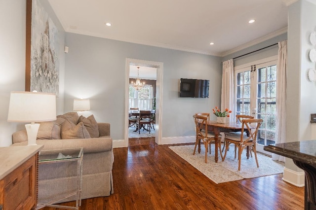 1514 Vance Ave, Memphis, TN 38104 - dining area with a chandelier, dark wood-type flooring, ornamental molding, baseboards, and recessed lighting