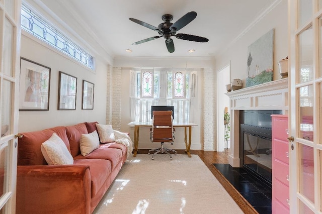1514 Vance Ave, Memphis, TN 38104 - living area with ornamental molding, a fireplace with flush hearth, ceiling fan, and wood finished floors