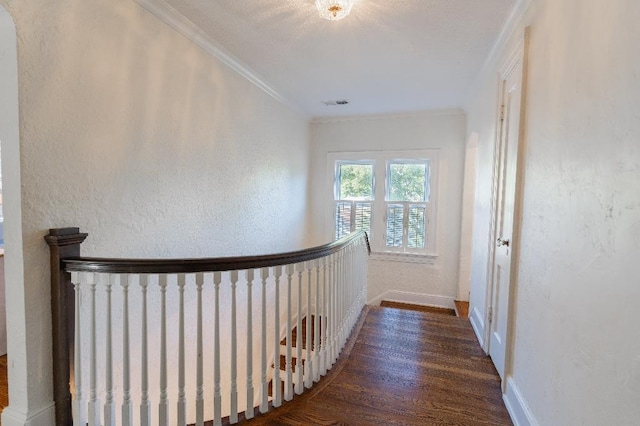 1514 Vance Ave, Memphis, TN 38104 - hallway featuring ornamental molding, wood finished floors, an upstairs landing, baseboards, and a textured wall