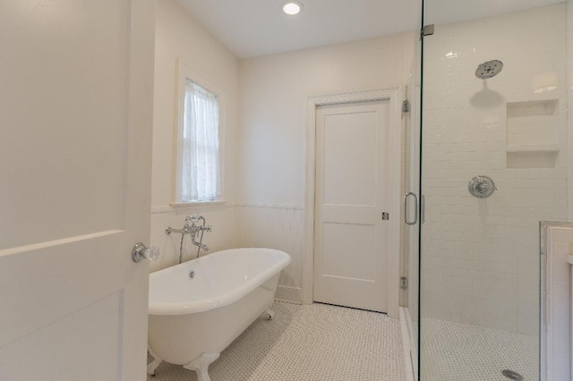 1514 Vance Ave, Memphis, TN 38104 - bathroom featuring a shower stall, a soaking tub, and a wainscoted wall
