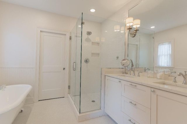 1514 Vance Ave, Memphis, TN 38104 - full bathroom with a shower stall, a wainscoted wall, a freestanding tub, double vanity, and tile patterned floors