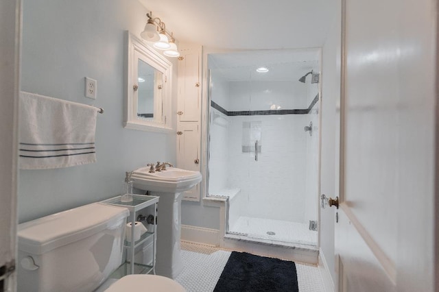 1514 Vance Ave, Memphis, TN 38104 - full bath with a stall shower, toilet, baseboards, and tile patterned flooring