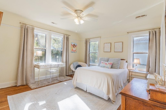 1514 Vance Ave, Memphis, TN 38104 - bedroom featuring light wood finished floors, a ceiling fan, and baseboards