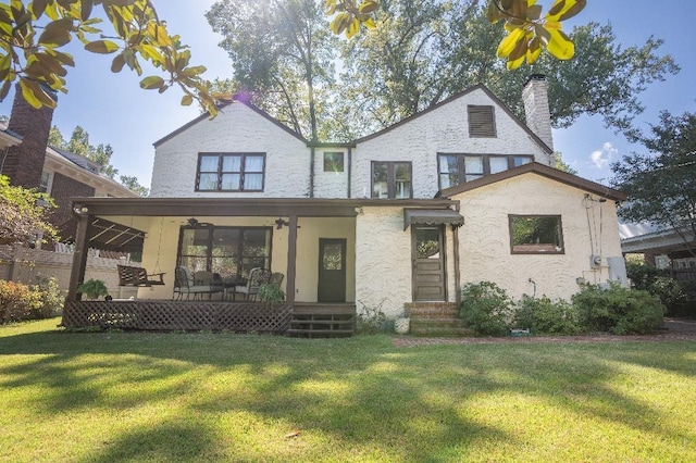1514 Vance Ave, Memphis, TN 38104 - view of front of home with ceiling fan, a chimney, entry steps, and stucco siding