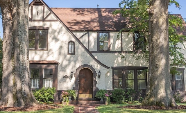 1514 Vance Ave, Memphis, TN 38104 - english style home featuring roof with shingles and stucco siding