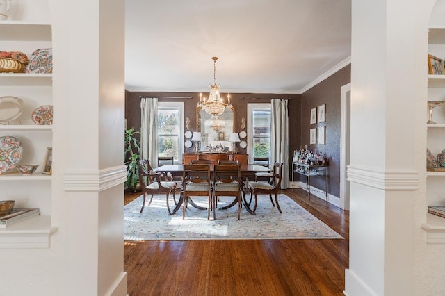 1514 Vance Ave, Memphis, TN 38104 - dining space featuring wood finished floors, ornamental molding, a chandelier, built in features, and baseboards
