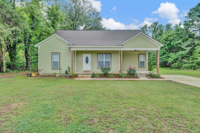 8077 Ellis Rd, Bartlett, TN 38133 - ranch-style house featuring a front yard, ceiling fan, a porch, and roof with shingles
