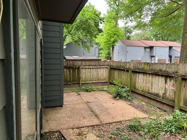 3970 Grahamdale Cir Unit 3970A, Memphis, TN 38122 - fenced backyard featuring a patio area