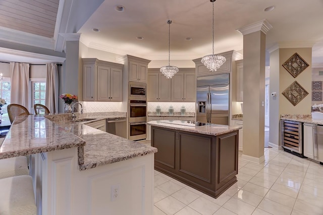 9470 Riveredge Dr, Memphis, TN 38018 - kitchen featuring built in appliances, beverage cooler, a sink, crown molding, and a peninsula