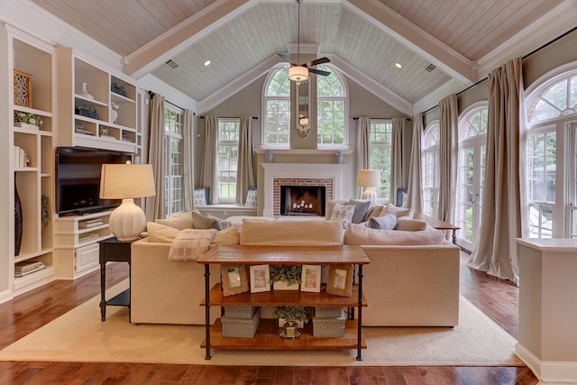 9470 Riveredge Dr, Memphis, TN 38018 - living room featuring healthy amount of natural light, hardwood / wood-style floors, a ceiling fan, a brick fireplace, and wood ceiling