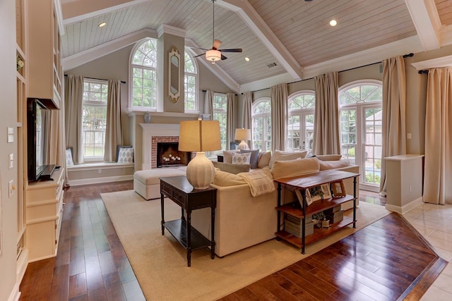 9470 Riveredge Dr, Memphis, TN 38018 - living room featuring plenty of natural light, dark wood finished floors, wooden ceiling, a brick fireplace, and a ceiling fan