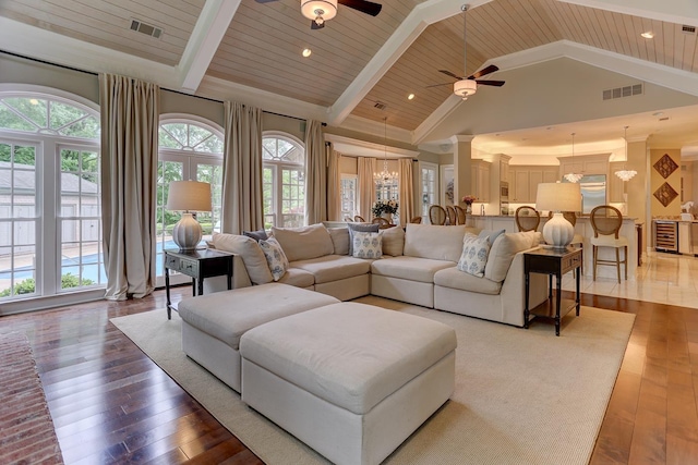 9470 Riveredge Dr, Memphis, TN 38018 - living room featuring a ceiling fan, high vaulted ceiling, hardwood / wood-style floors, wooden ceiling with exposed beams, and wine cooler