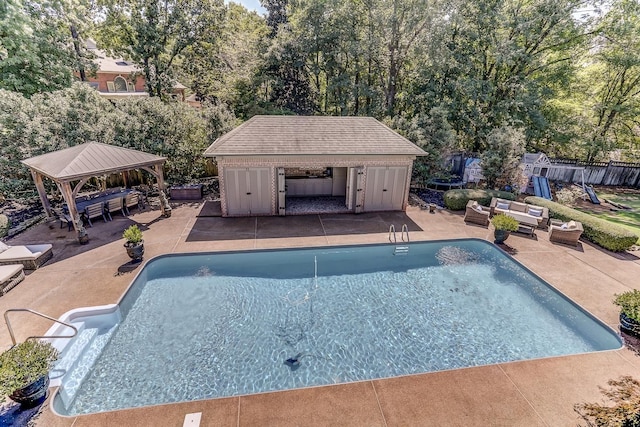 9470 Riveredge Dr, Memphis, TN 38018 - view of pool featuring outdoor lounge area, a patio, a gazebo, and an outbuilding