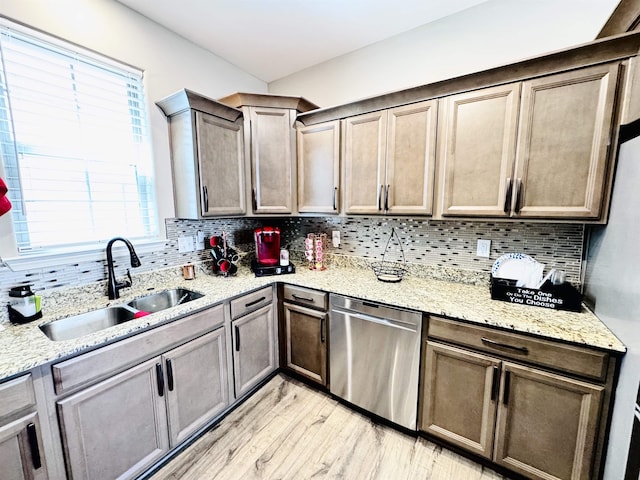 10156 Amberton Cv, Cordova, TN 38018 - kitchen with a sink, dishwasher, tasteful backsplash, and light wood-style floors