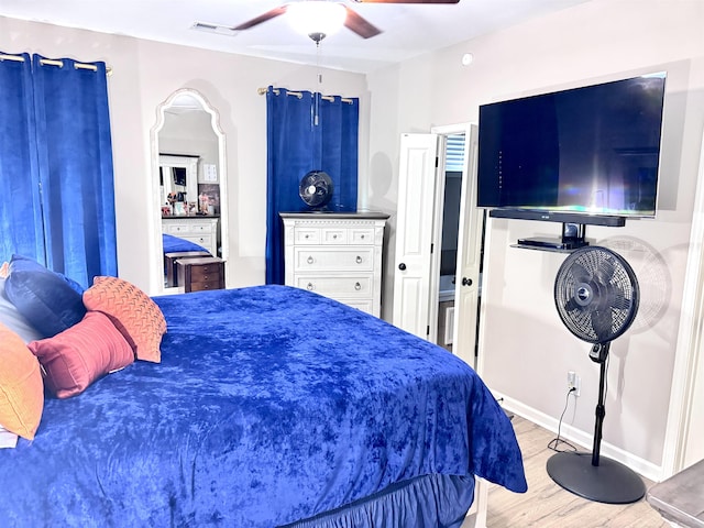 10156 Amberton Cv, Cordova, TN 38018 - bedroom featuring wood finished floors, a ceiling fan, and baseboards