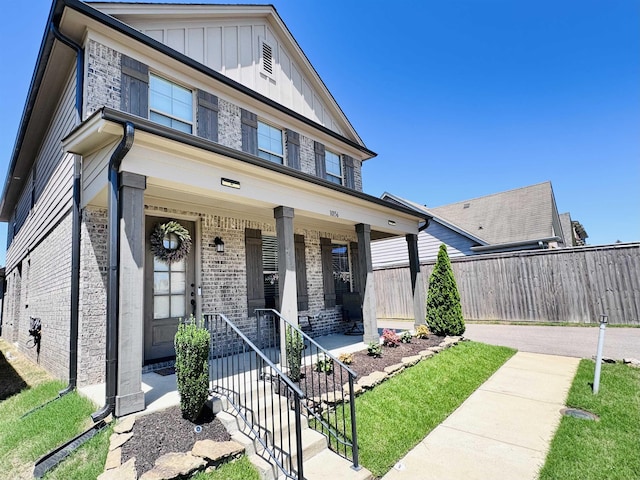 10156 Amberton Cv, Cordova, TN 38018 - view of front facade with brick siding, board and batten siding, and a porch
