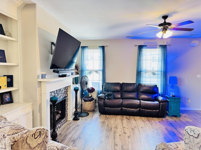10156 Amberton Cv, Cordova, TN 38018 - living room featuring hardwood / wood-style flooring, a ceiling fan, a fireplace, and built in shelves