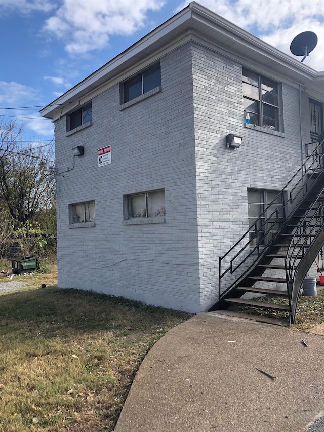 487 Williams Ave, Memphis, TN 38126 - view of home's exterior with stairs and brick siding