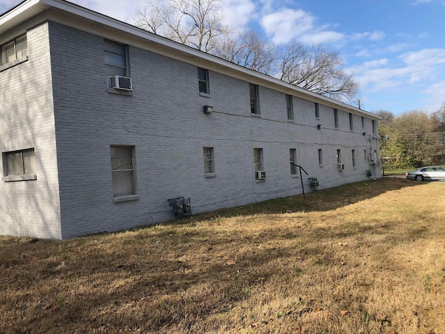 487 Williams Ave, Memphis, TN 38126 - view of side of property with brick siding, a yard, and cooling unit