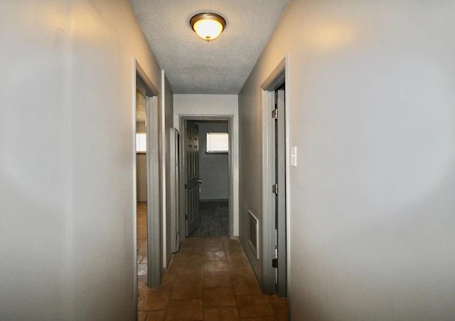 487 Williams Ave, Memphis, TN 38126 - hall with a textured ceiling