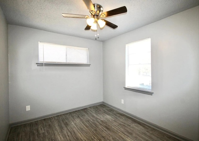 487 Williams Ave, Memphis, TN 38126 - spare room with dark wood finished floors, ceiling fan, baseboards, and a textured ceiling