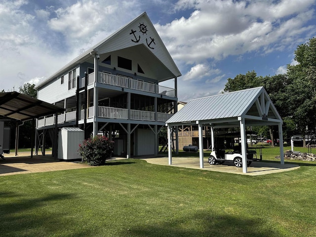 552 Catfish Ln, Crump, TN 38327 - rear view of property with a lawn and a carport