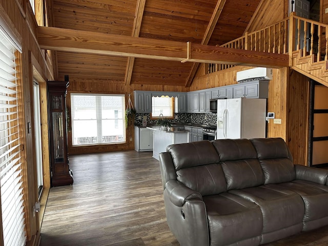 552 Catfish Ln, Crump, TN 38327 - living area featuring a wall unit AC, wood ceiling with exposed beams, high vaulted ceiling, dark wood-style floors, and wooden walls