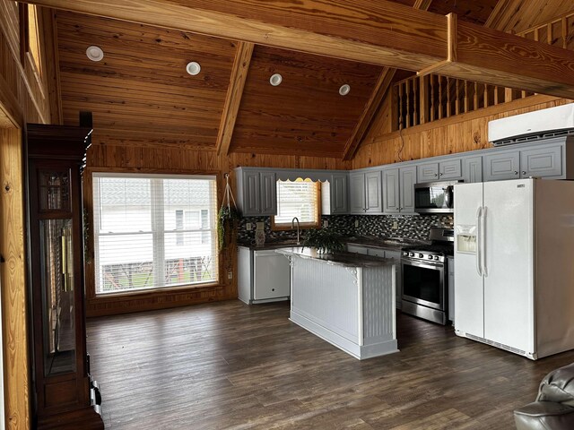 552 Catfish Ln, Crump, TN 38327 - kitchen with stainless steel appliances, dark countertops, a wall mounted air conditioner, plenty of natural light, and wooden ceiling