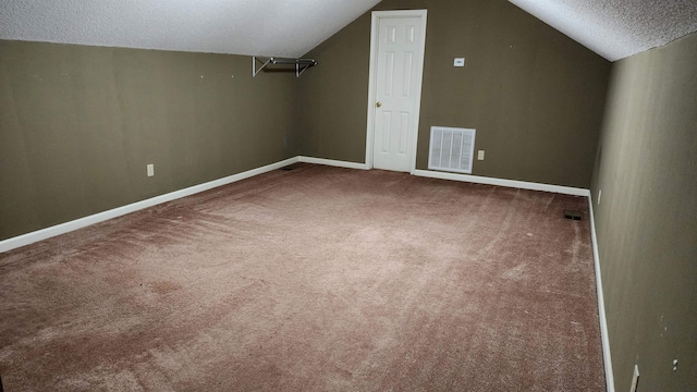 445 Caldwell Rd, Ripley, TN 38063 - bonus room with a textured ceiling, carpet, lofted ceiling, and baseboards