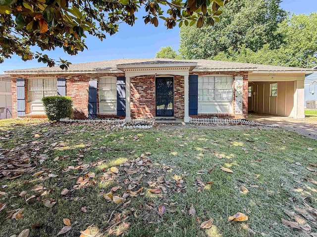 1170 Stage Ave, Memphis, TN 38127 - ranch-style house with an attached carport, brick siding, and a front lawn