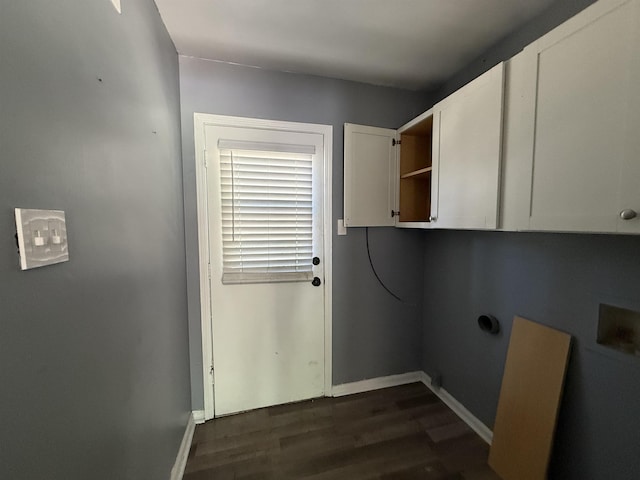 1170 Stage Ave, Memphis, TN 38127 - laundry room featuring cabinet space, dark wood-type flooring, and baseboards