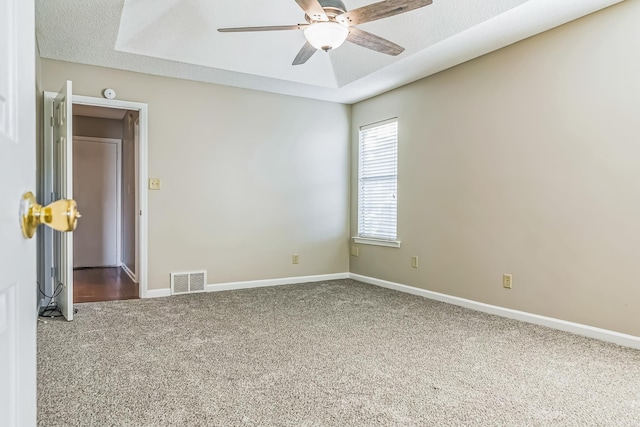 1168 E Red Fern Cir, Cordova, TN 38018 - spare room with carpet, a ceiling fan, baseboards, and a raised ceiling