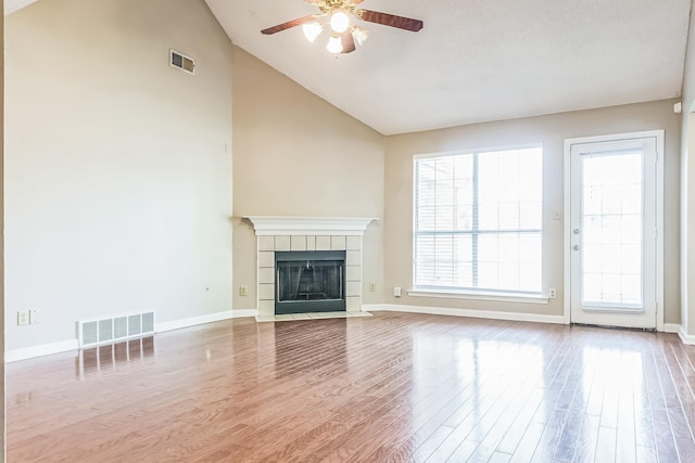1168 E Red Fern Cir, Cordova, TN 38018 - unfurnished living room featuring ceiling fan, wood finished floors, a fireplace, high vaulted ceiling, and baseboards