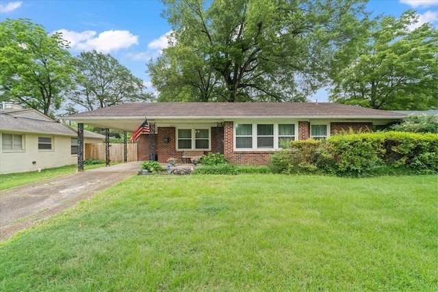 4841 Dee Rd, Memphis, TN 38117 - view of front of home featuring concrete driveway, a carport, and brick siding