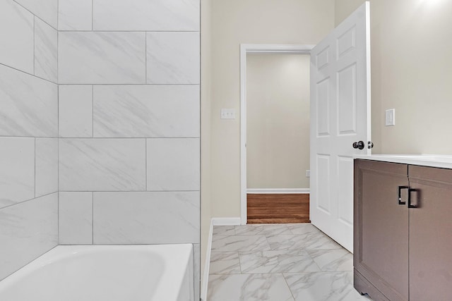 510 Leath St, Memphis, TN 38105 - full bathroom featuring marble look tile flooring, a bath, and vanity
