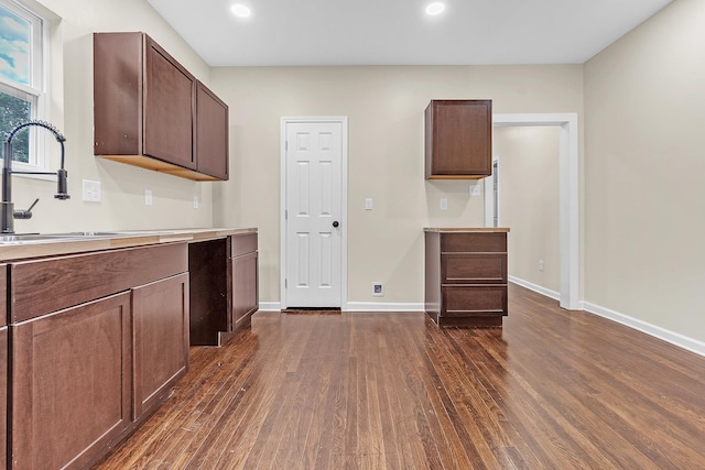 510 Leath St, Memphis, TN 38105 - kitchen with dark wood-style flooring, a sink, light countertops, recessed lighting, and baseboards