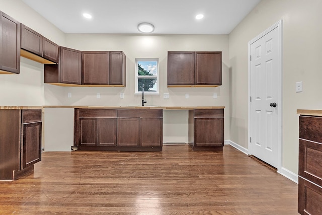 510 Leath St, Memphis, TN 38105 - kitchen featuring a sink, dark brown cabinets, dark wood finished floors, recessed lighting, and light countertops